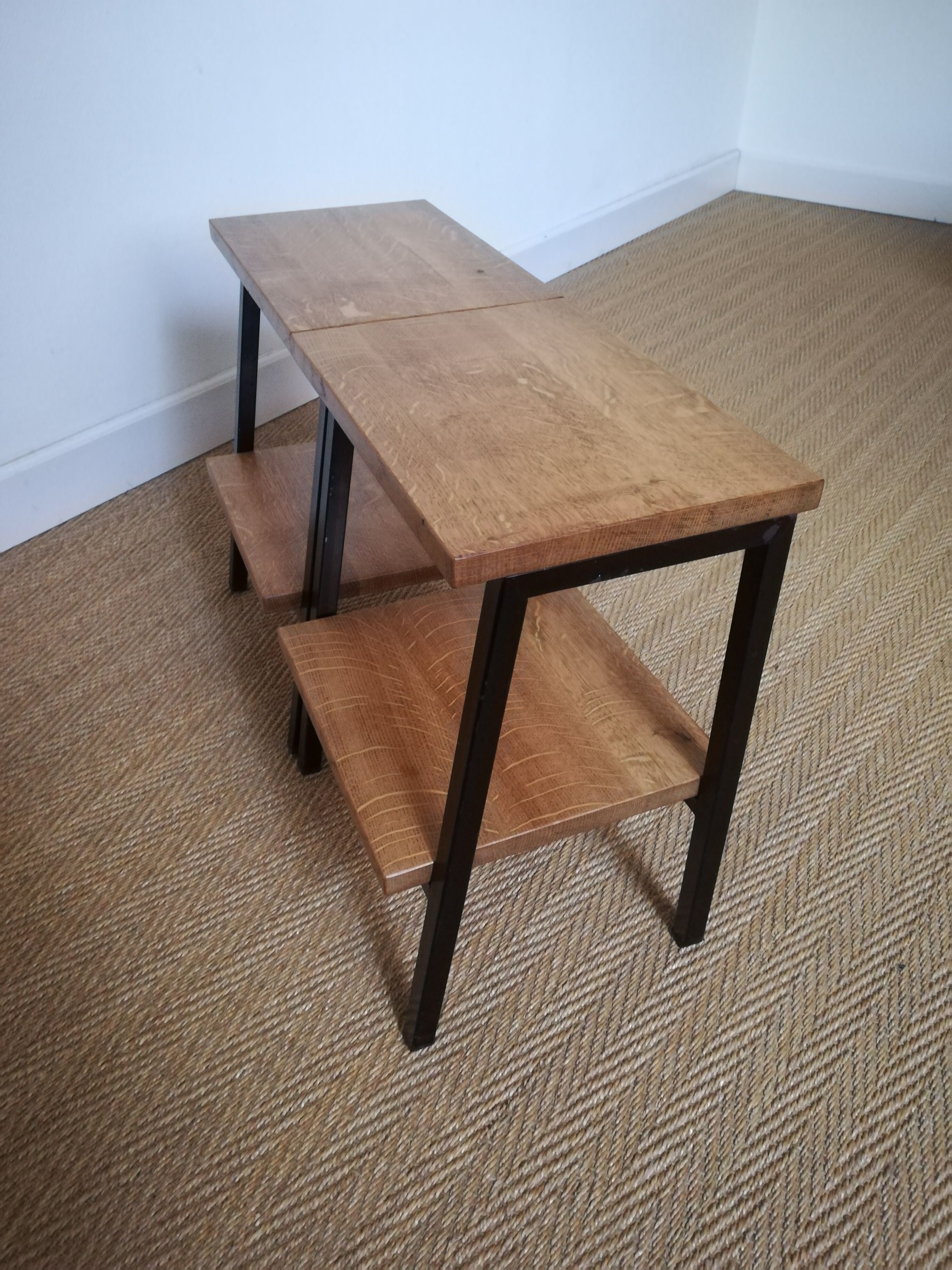 A pair of bedside tables