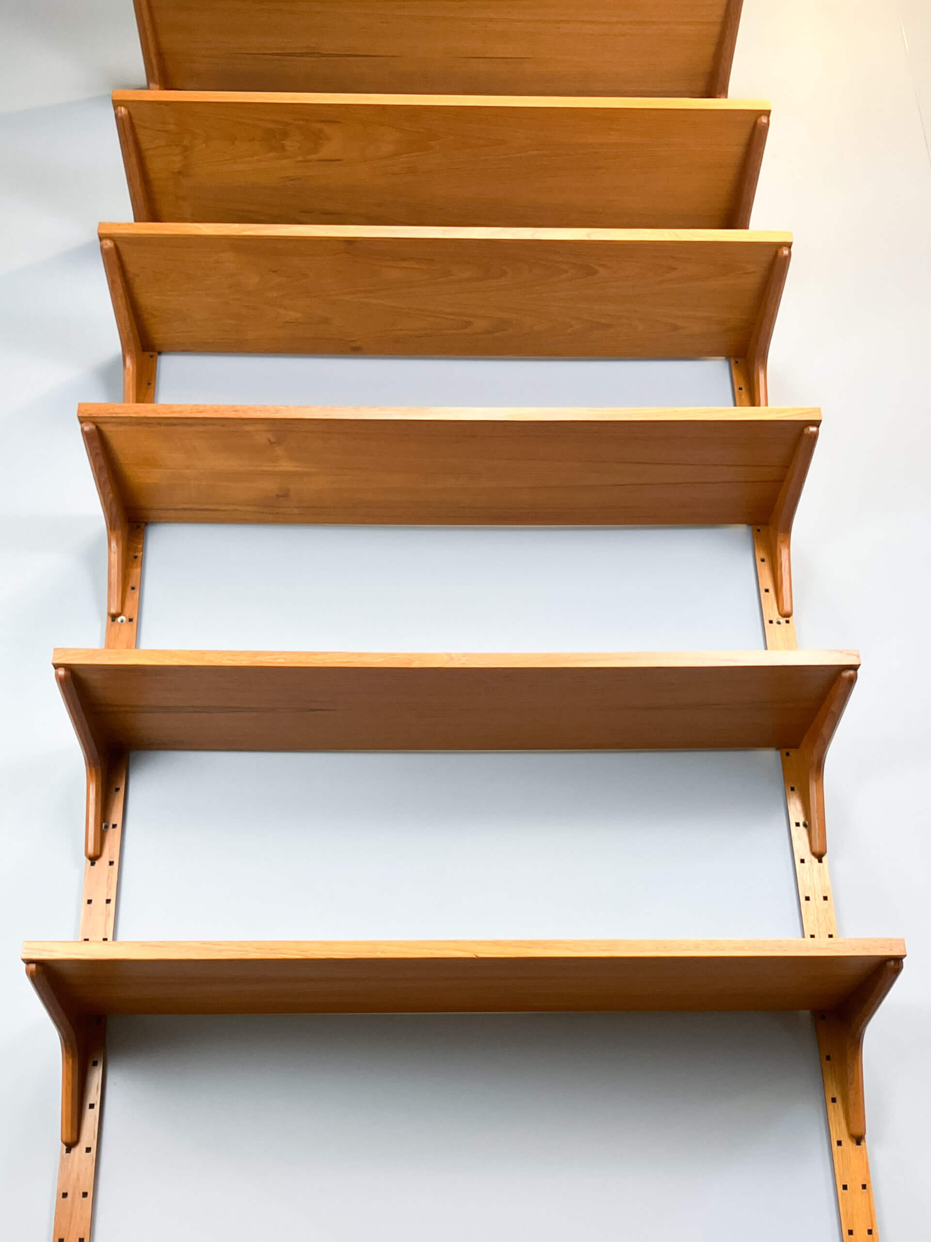 Danish wall shelf by Hansen and Guldborg, teak, aluminum rails, 1960s.