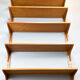 Danish wall shelf by Hansen and Guldborg, teak, aluminum rails, 1960s.