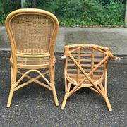 2 rattan and caned chairs in colonial bistro style from the 1990s.