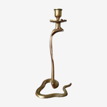 Candlestick mounted on brass cobra