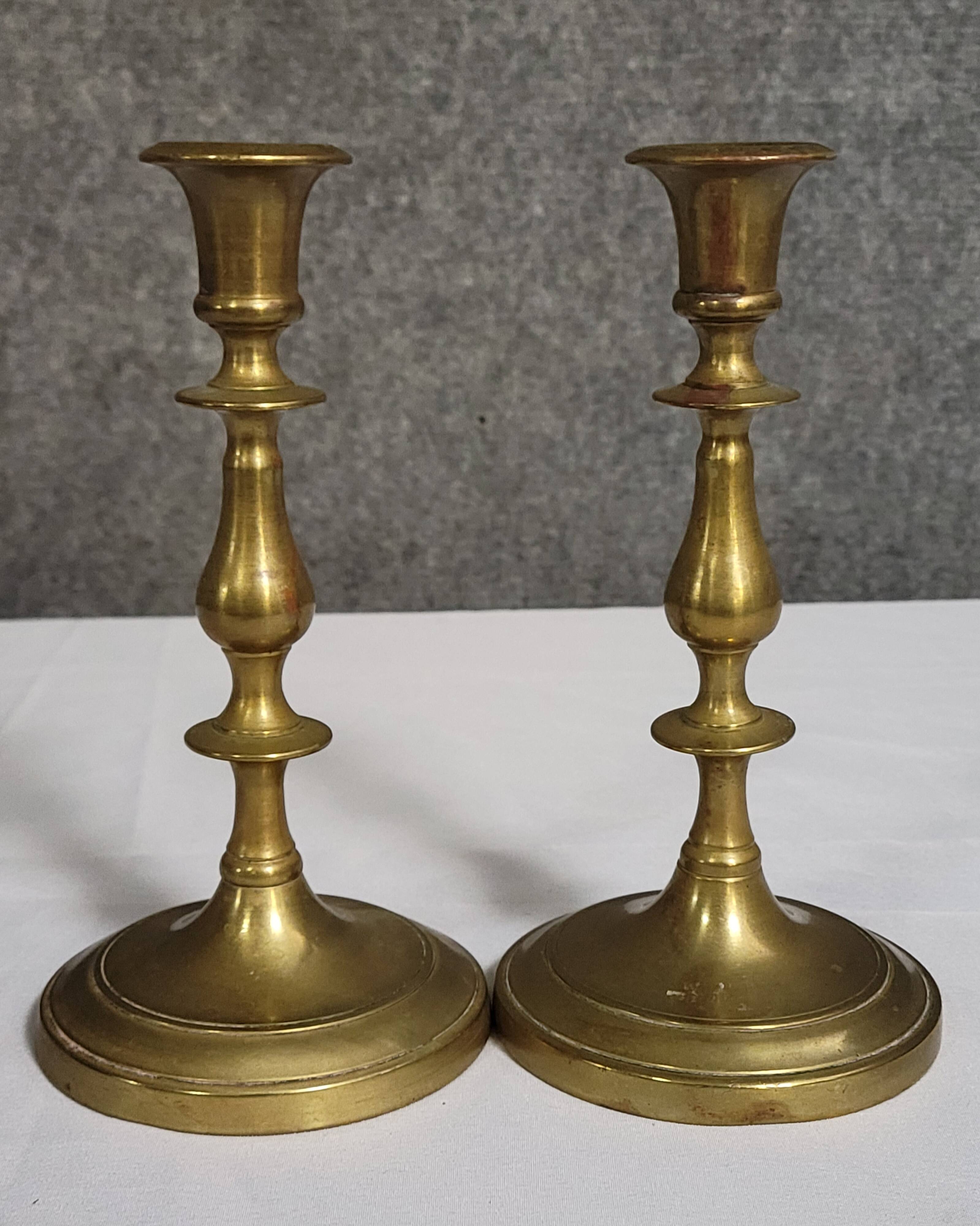 Pair of antique brass candlesticks, finely turned, dating from the 19th century