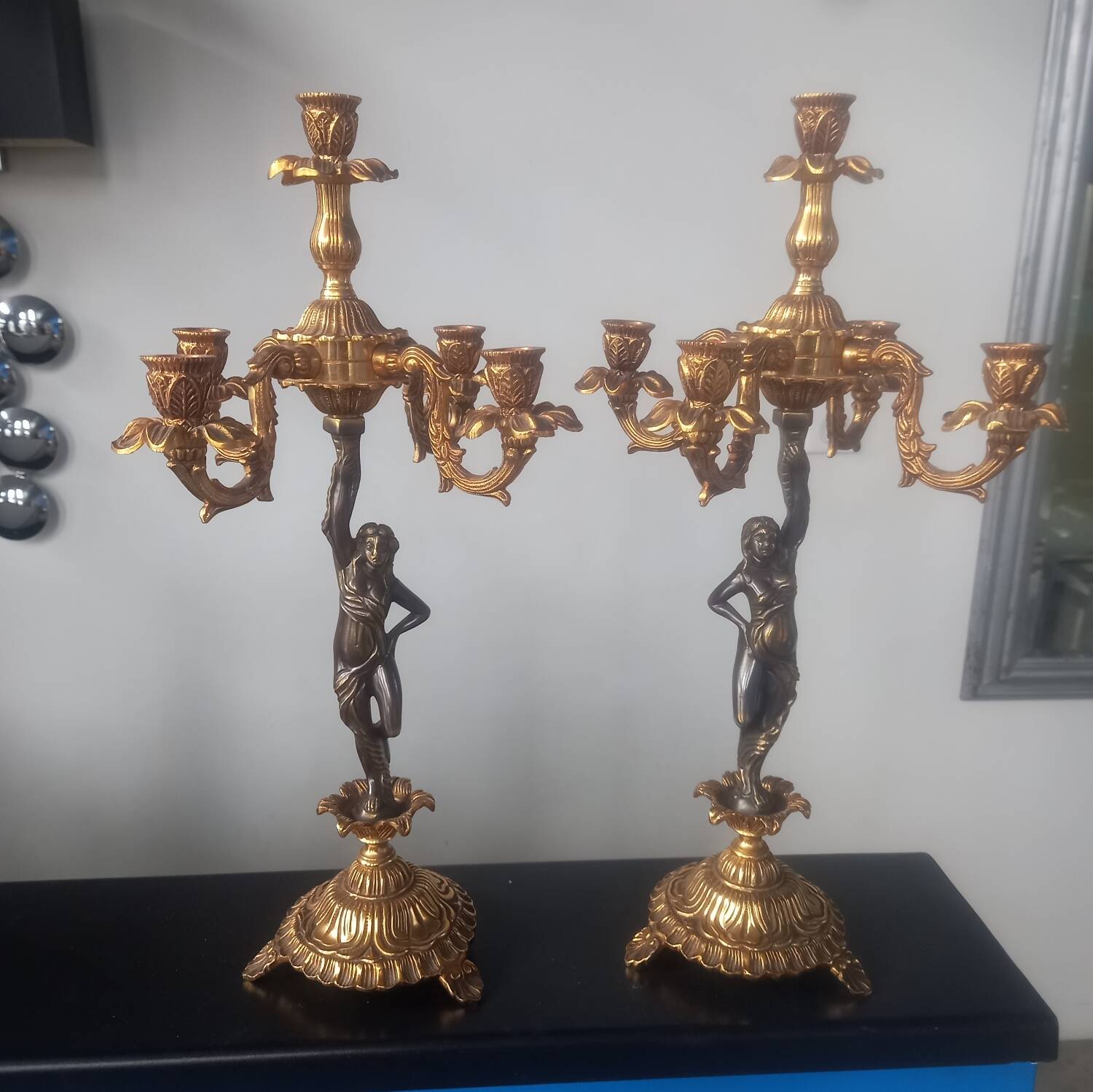 Pair of gilded bronze candlesticks with nude women