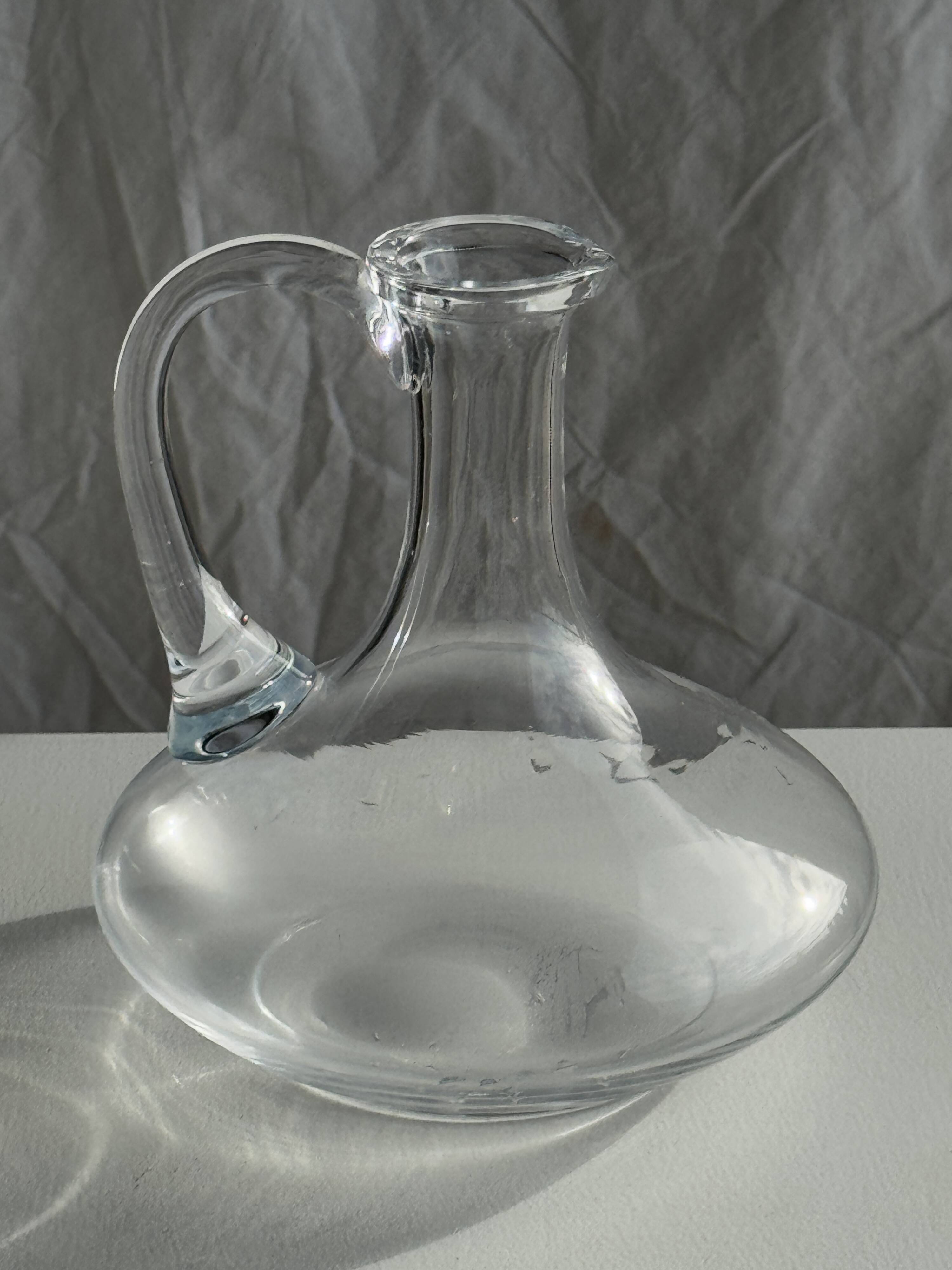 Vintage glass carafe with flattened flared belly handle H18