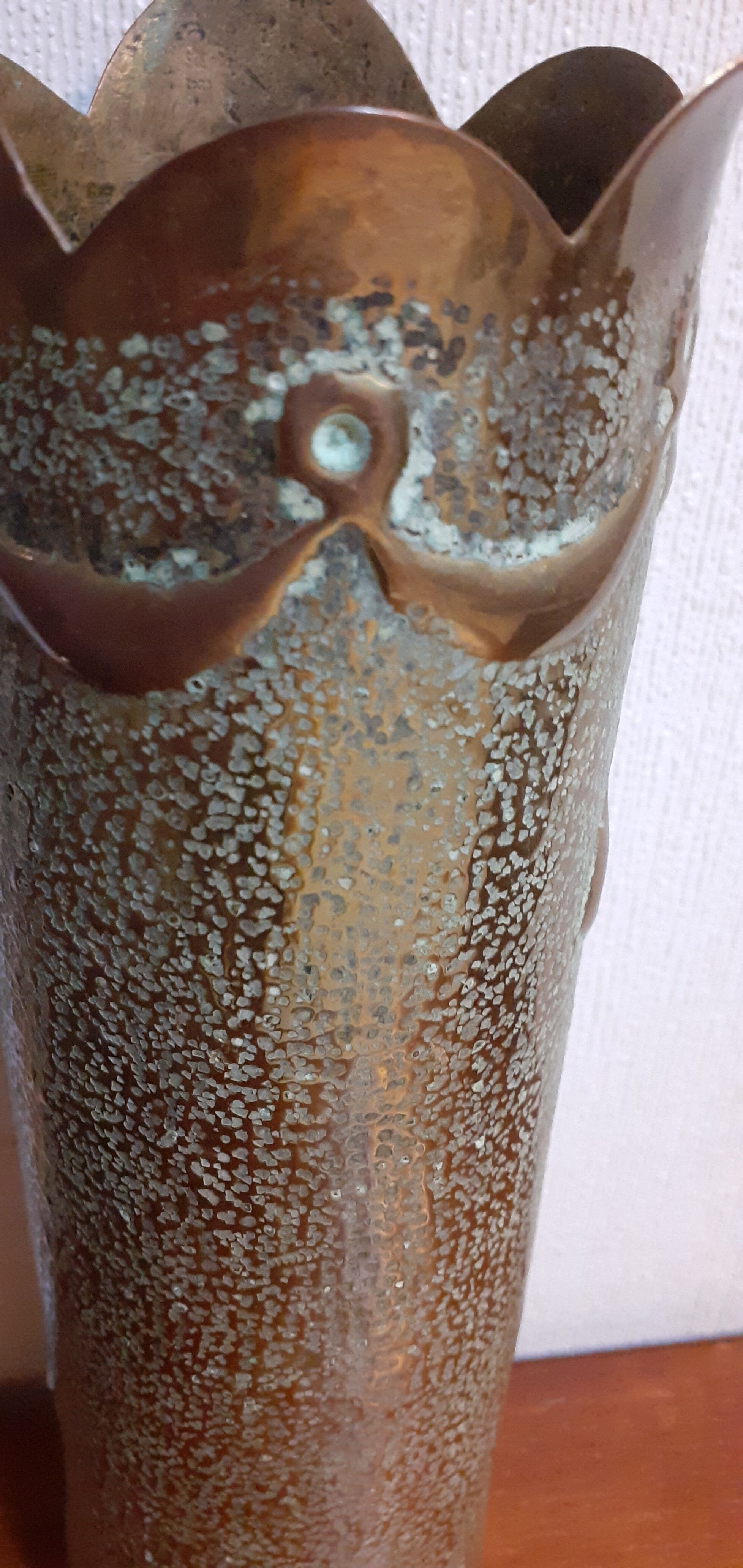 Shell casing vase carved into the trenches