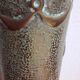 Shell casing vase carved into the trenches