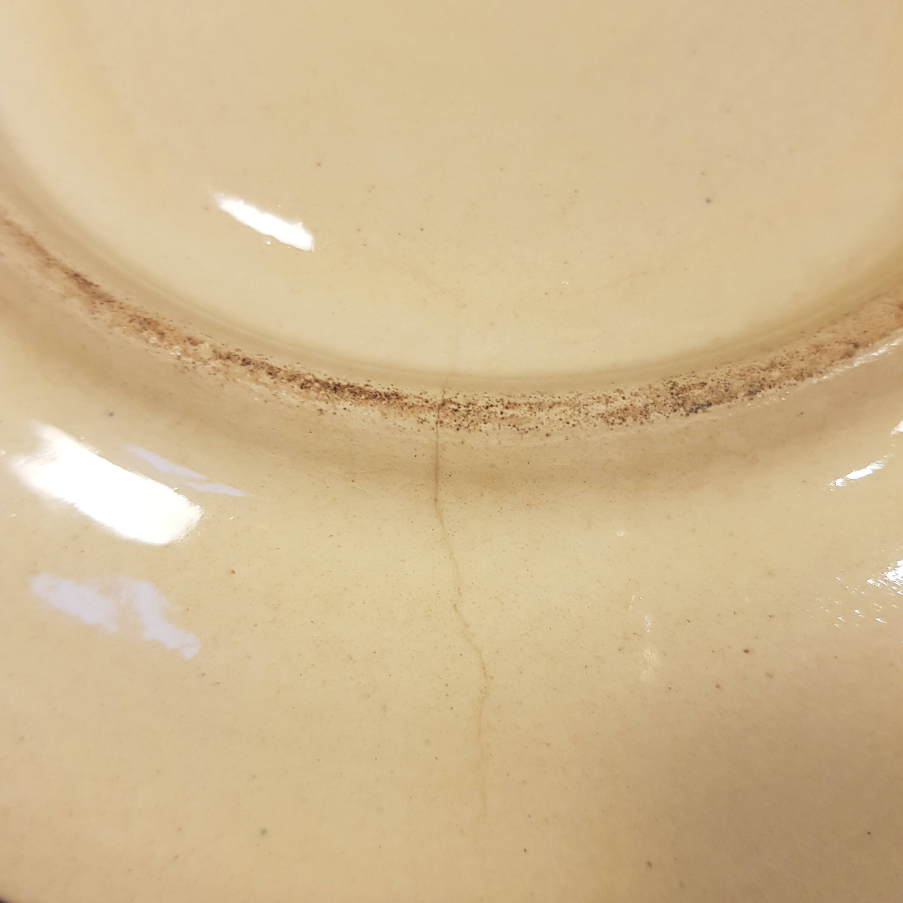 4 Quimper earthenware saucers or plates