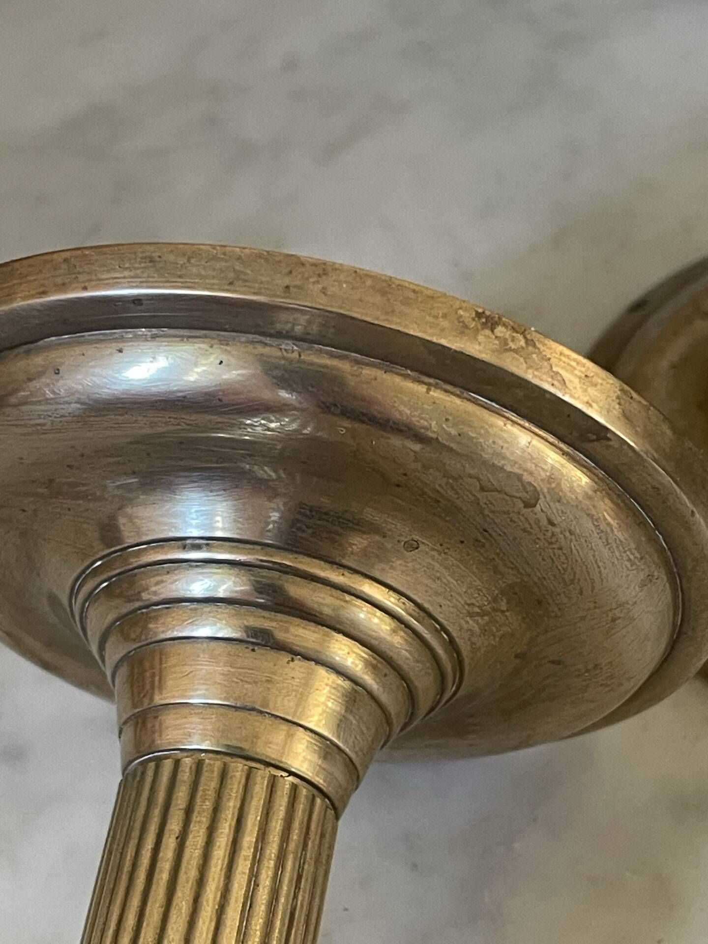 Pair of fluted column candlesticks in brass