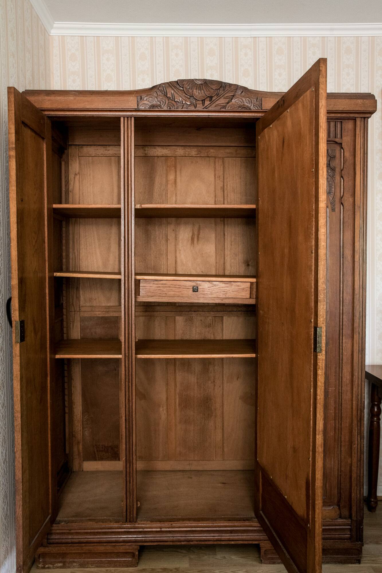 Old solid wood wardrobe with three vintage mirror doors