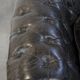 Spacious black cow leather chesterfield armchair with distinctive character