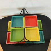 Black metal appetizer set with colorful ceramic ramekins