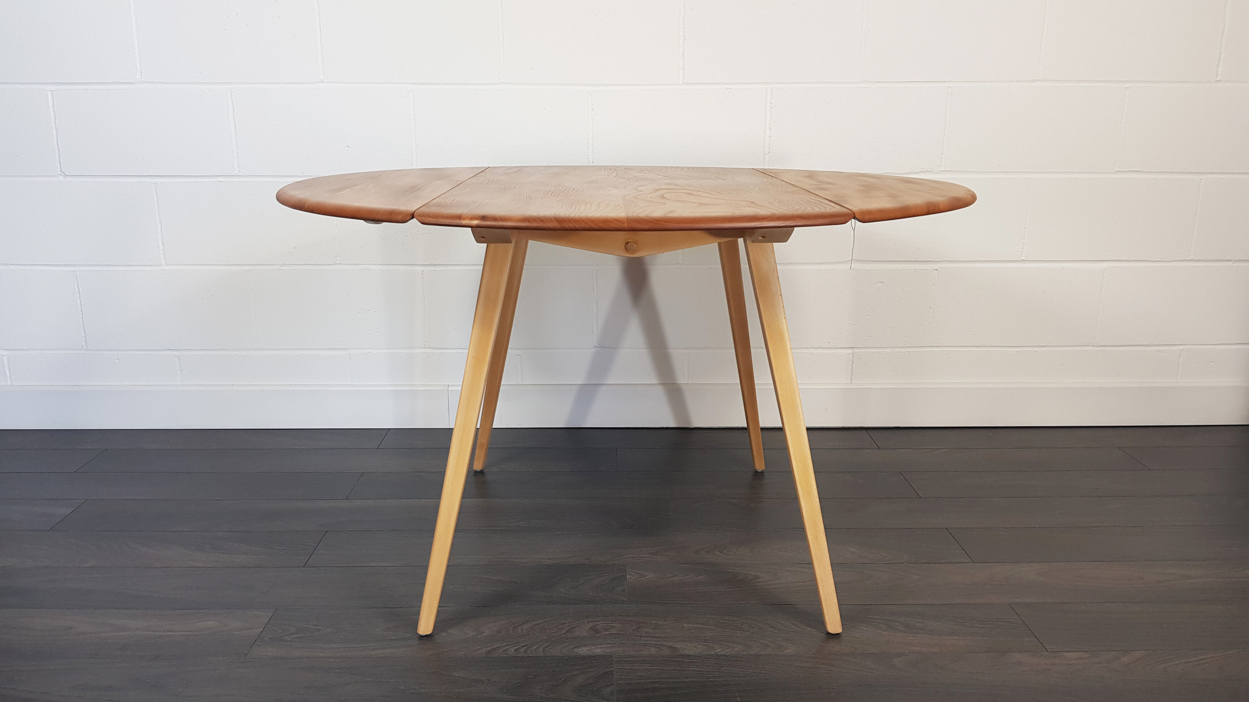 Ercol round drop leaf dining table, 1960s