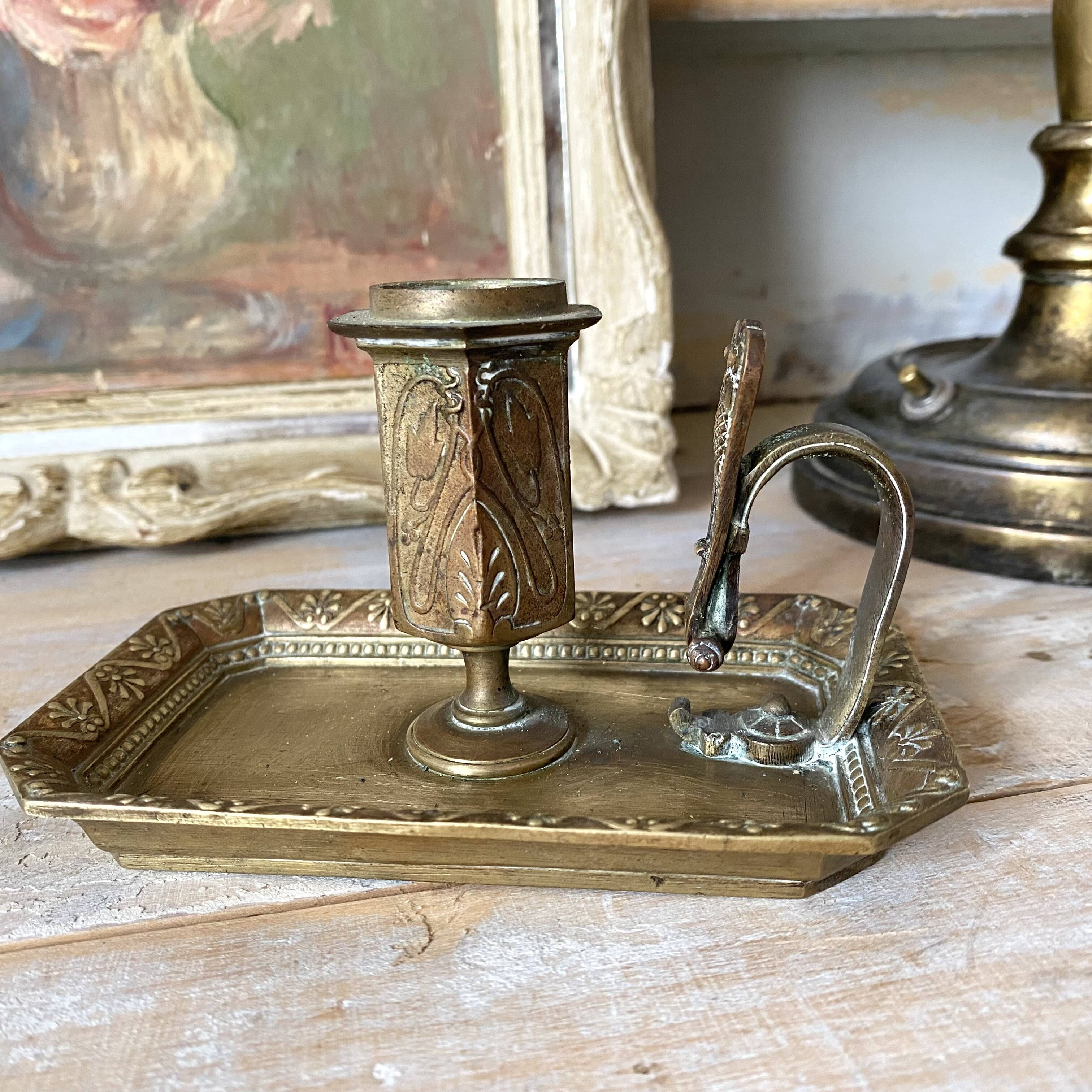 Antique brass thumb candle holder
