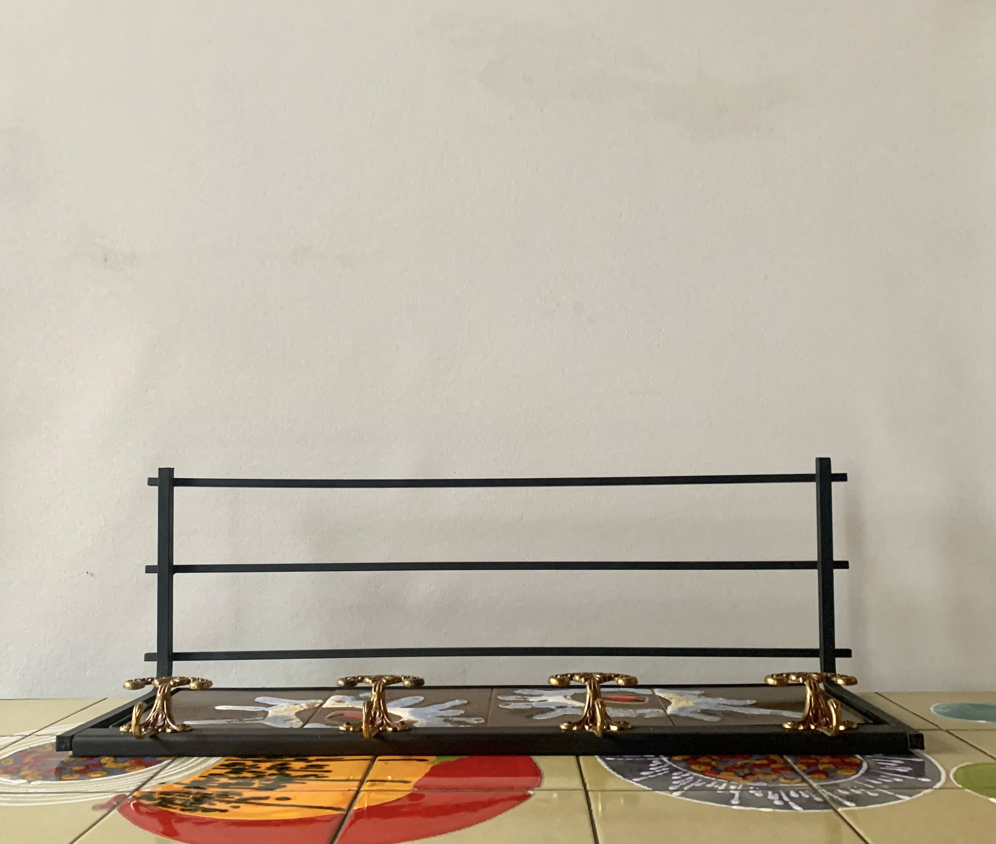 Vintage wall-mounted coat rack in steel, brass and ceramic