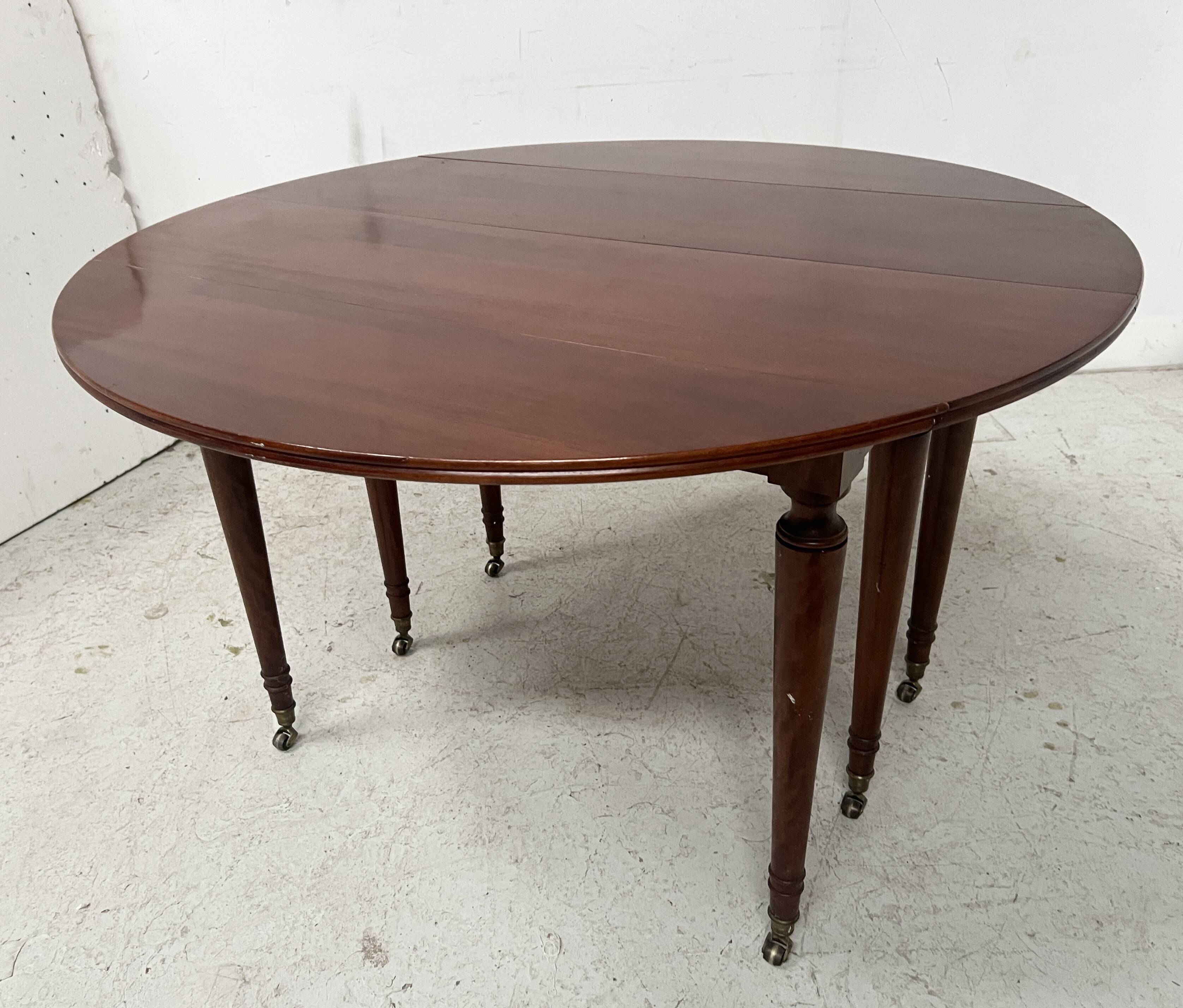 A six-foot Louis XVI style mahogany table from the 19th century.