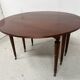 A six-foot Louis XVI style mahogany table from the 19th century.