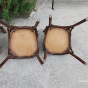 4 bentwood bistro chairs with a pattern on the seat