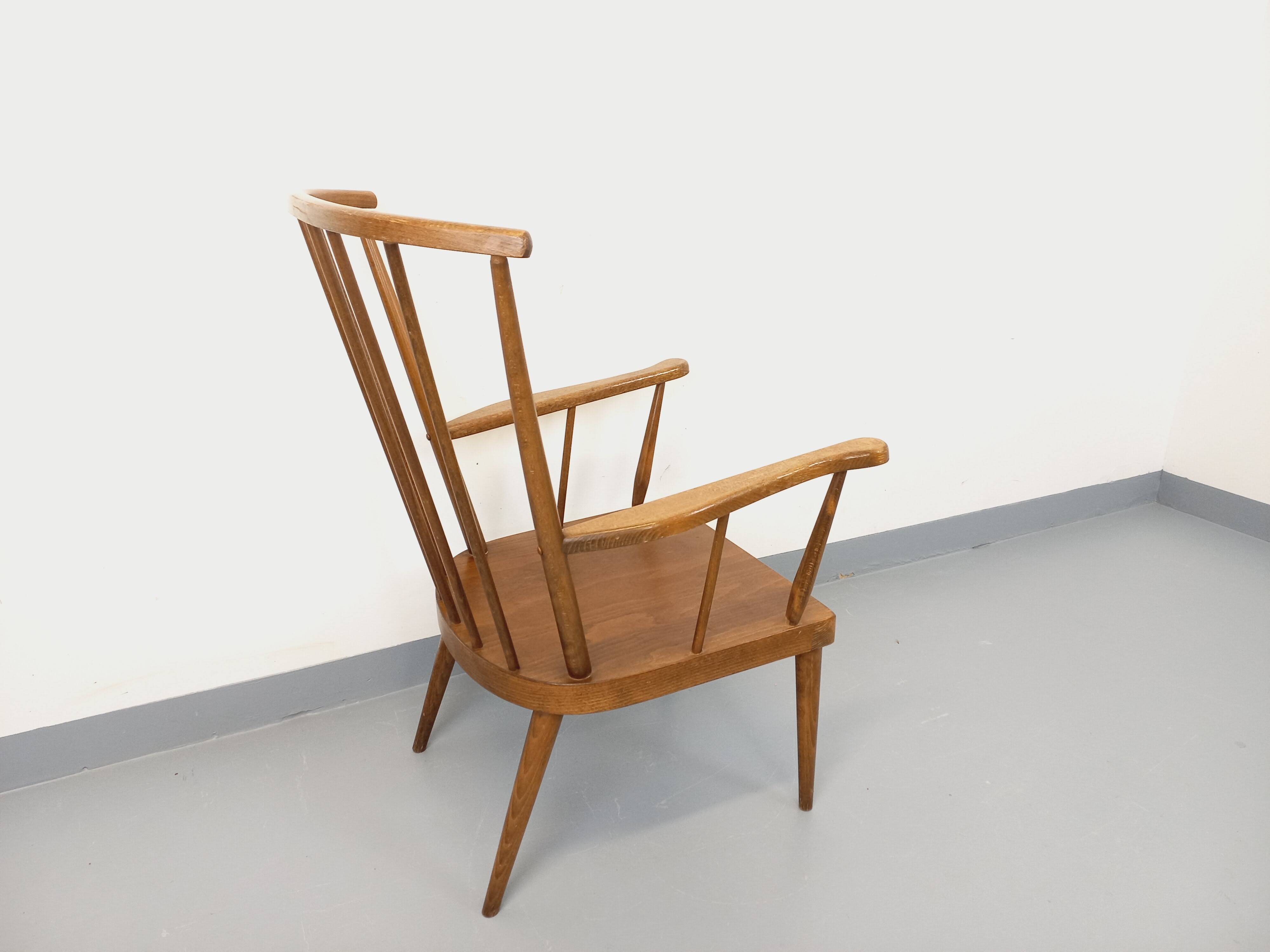 Vintage wooden armchair Baumann model Éventail from the 1960s.