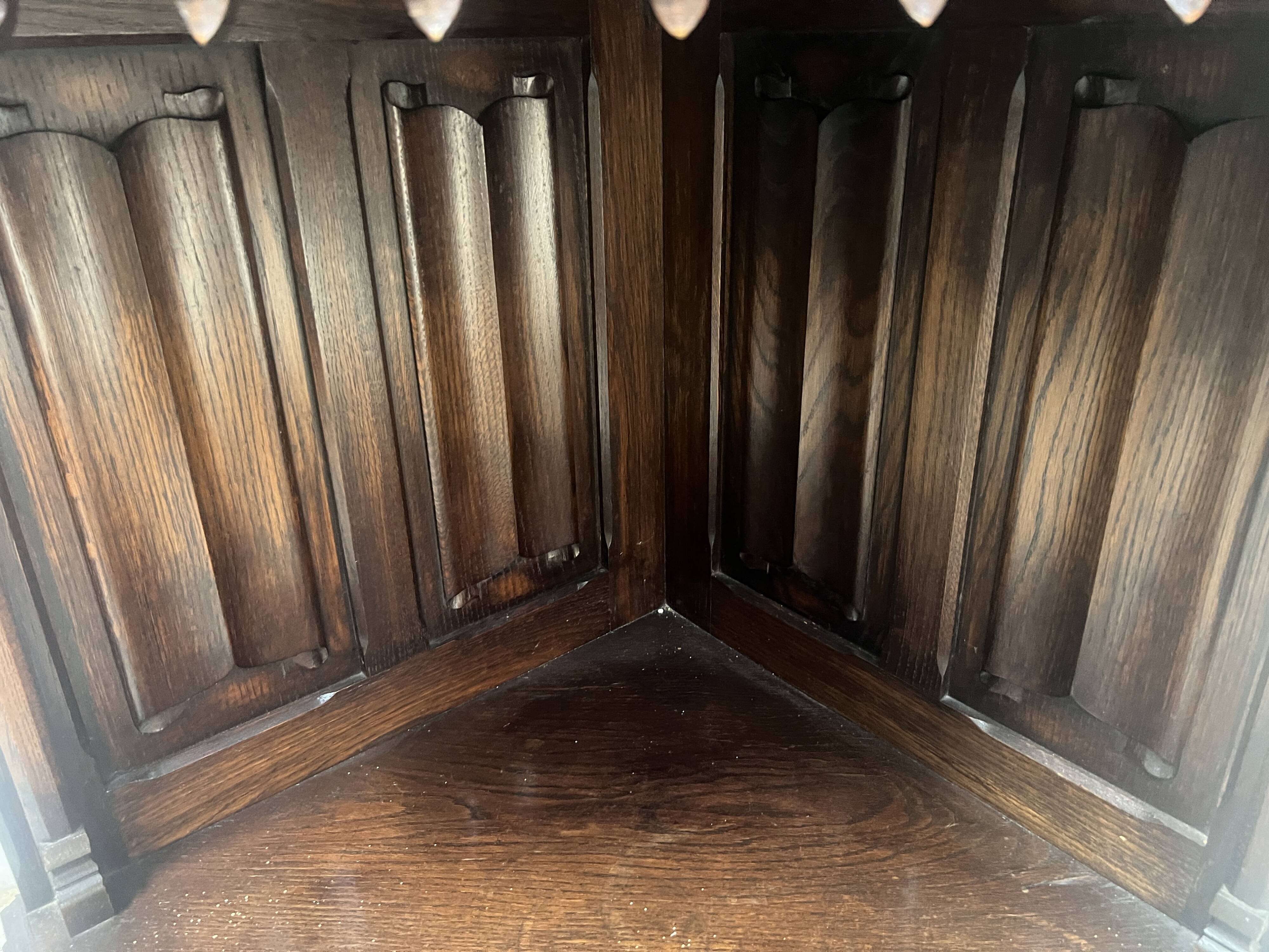 Gothic-style corner cabinet in solid oak, 20th century.