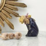 Frog carries bouquet