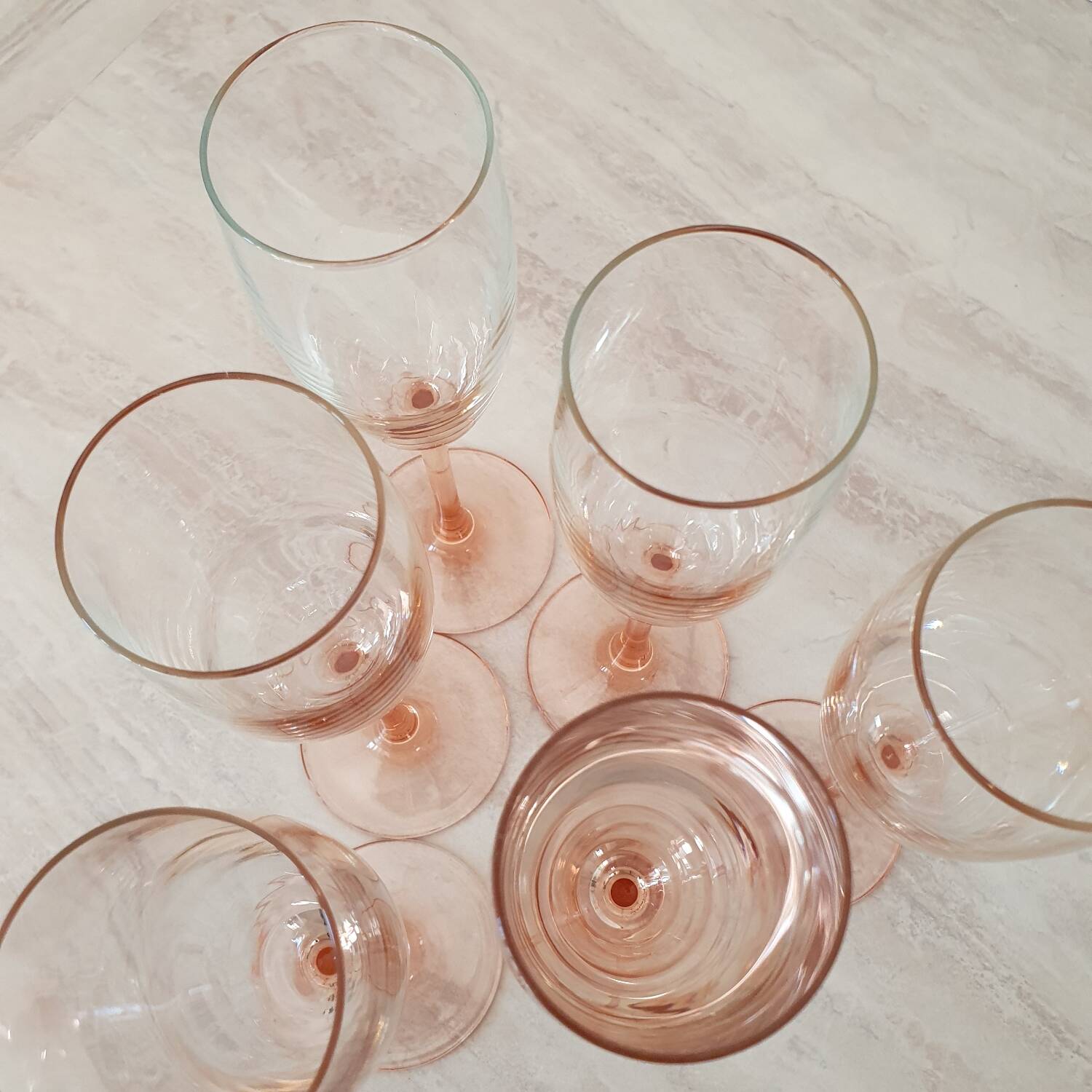 6 champagne flutes with pink stems