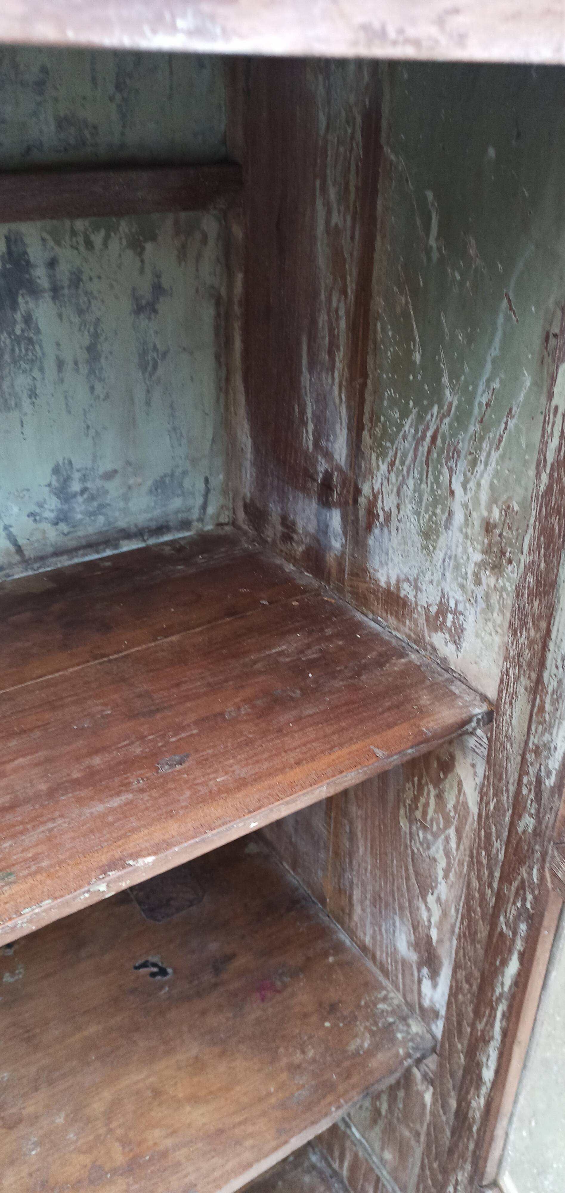 Old glazed wooden cabinet with metal bottom