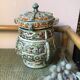 Stoneware pot with Asian decoration