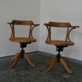 A pair of vintage bent wood svivel chairs by Salvaatore Leone Italy