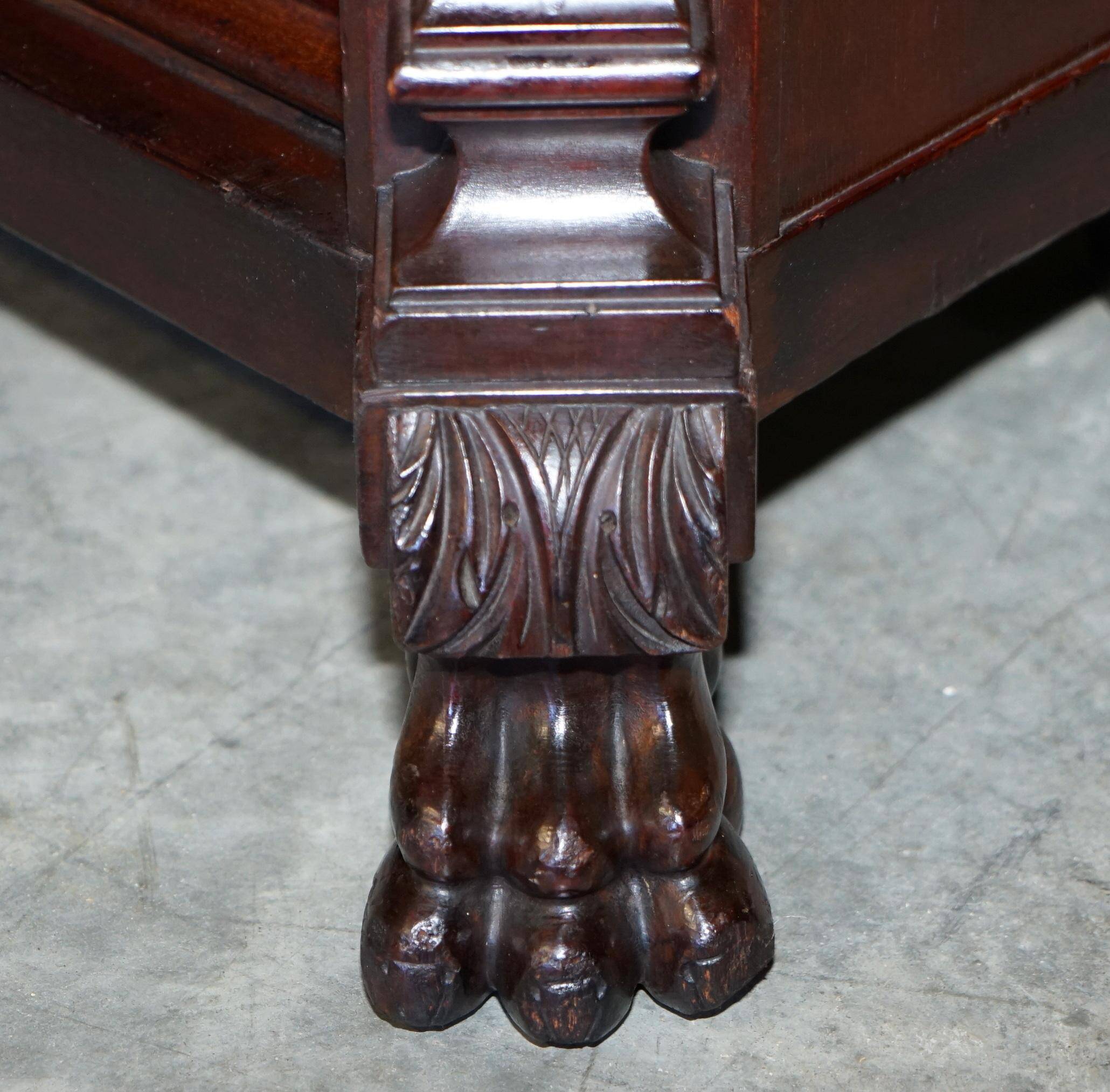Hand-carved library circa 1900 in hardwood with Hermes statues.