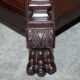 Hand-carved library circa 1900 in hardwood with Hermes statues.