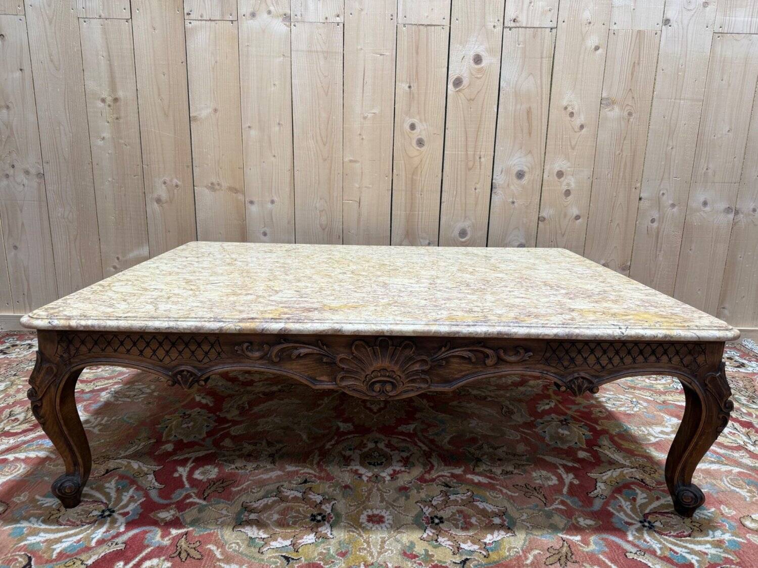 Louis XV style coffee table in walnut with a marble top.