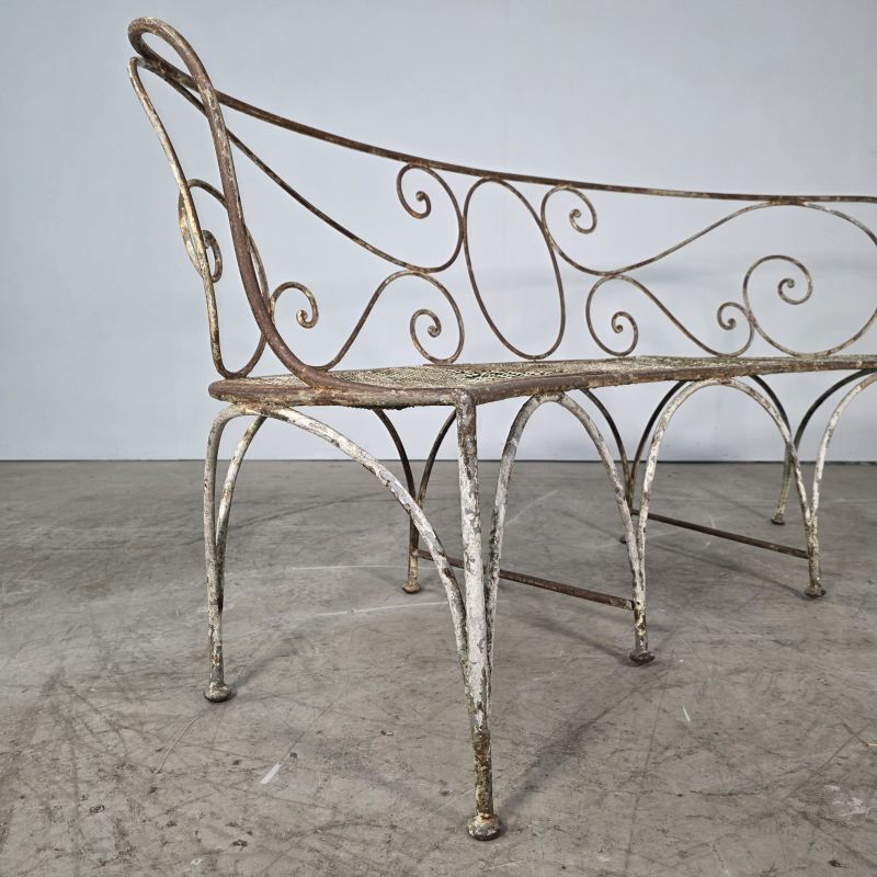 Beautiful curved garden bench from the late 19th century in iron.