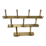 Three vintage 1960s gold coat racks 4, 3 and 2 hooks