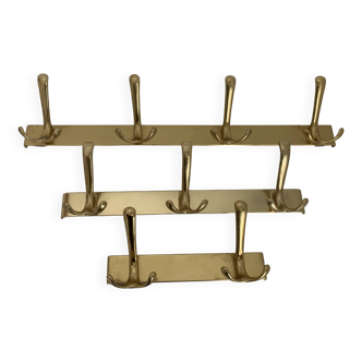 Three vintage 1960s gold coat racks 4, 3 and 2 hooks