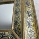 Eglomisé mirror with wooden parecloses