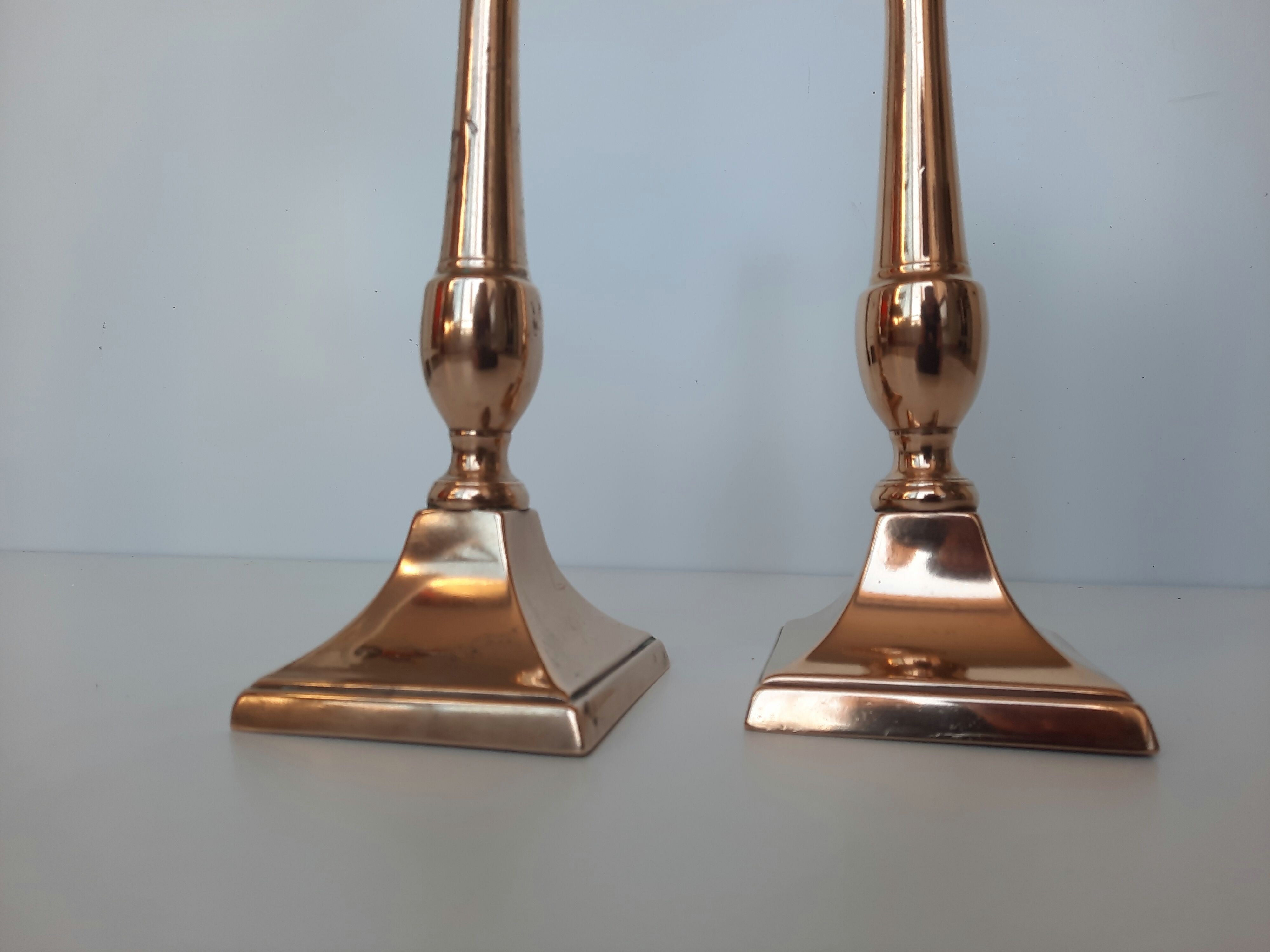 Pair of square foot copper candle holders
