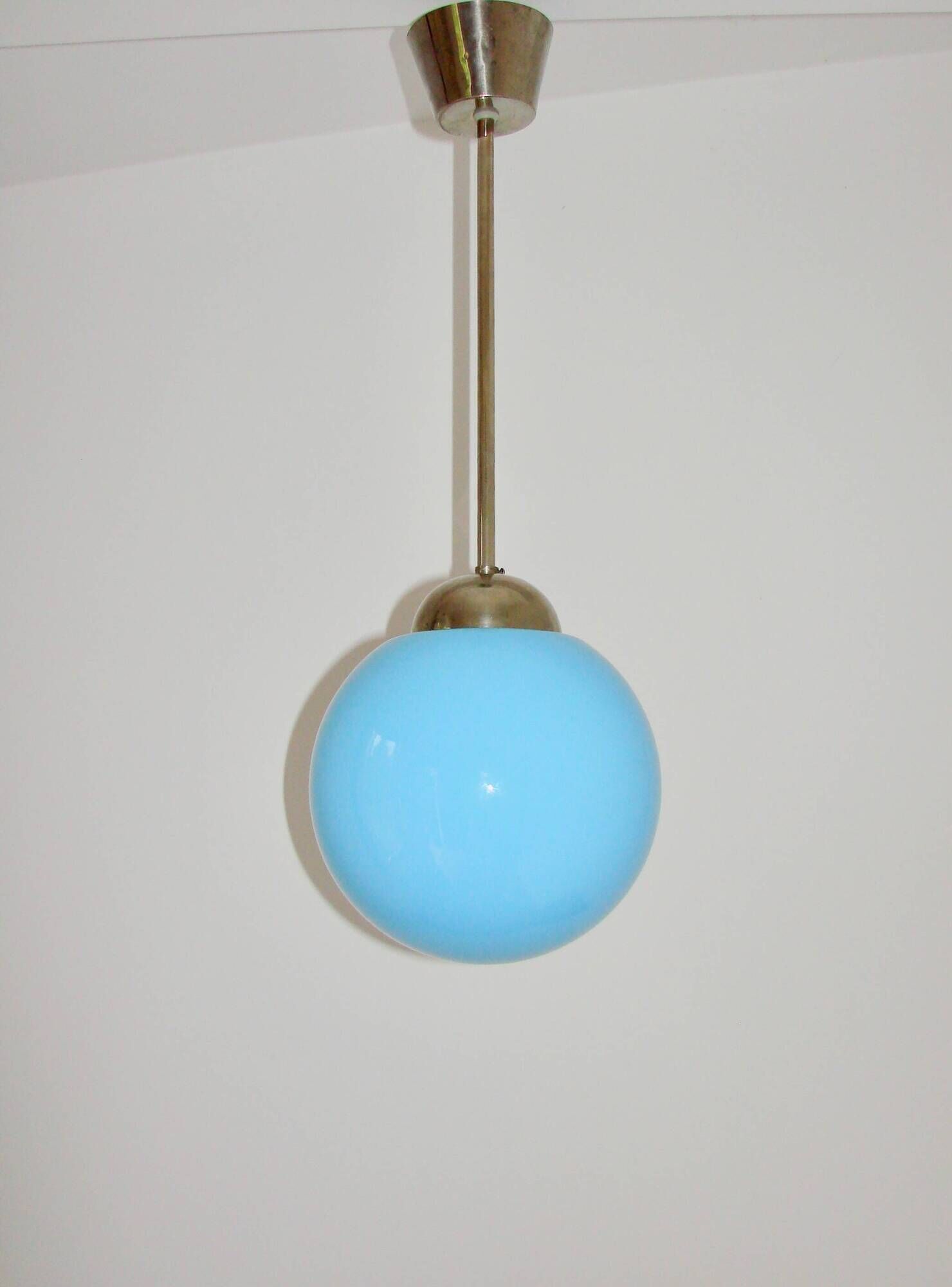 A pendant lamp with a blue glass shade, 1940s.