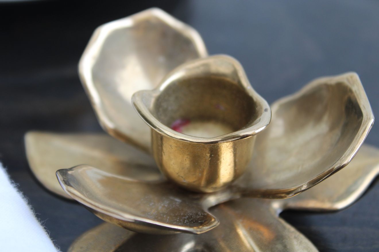 Golden brass candle holder