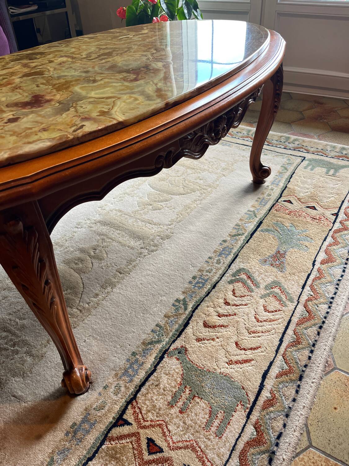 Oval marble and solid wood coffee table