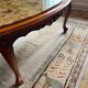 Oval marble and solid wood coffee table