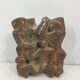 Plaster sculpture depicting a group of 3 figures