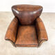 Fauteuil en cuir de mouton foncé fijnaart