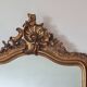 Antique Louis Philippe mirror with a pediment.