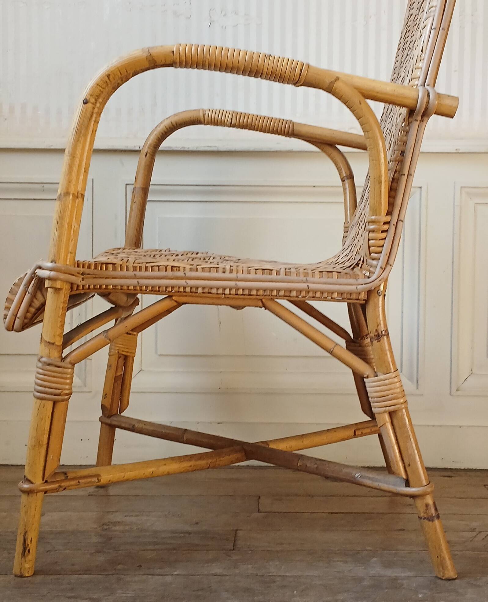 High-backed adult rattan armchair, circa 1960