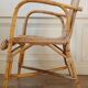 High-backed adult rattan armchair, circa 1960