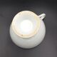 Tasse blanche de style empire XlXème, Porcelaine de Paris
