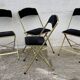 Set of 4 vintage 1950s chaisor folding chairs in gold and black.