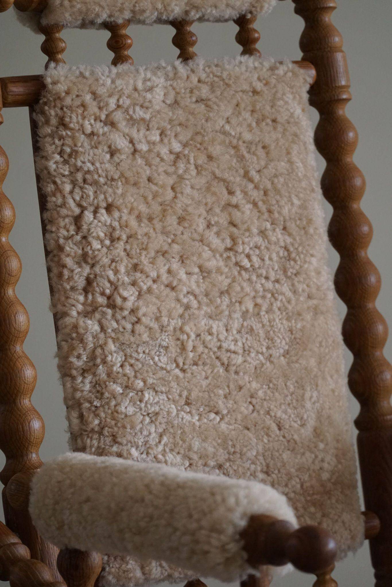 Pair of sculptural Danish modern rocking chairs in lambswool and oak, brutalist, 1950.