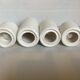 Four white earthenware candle holders