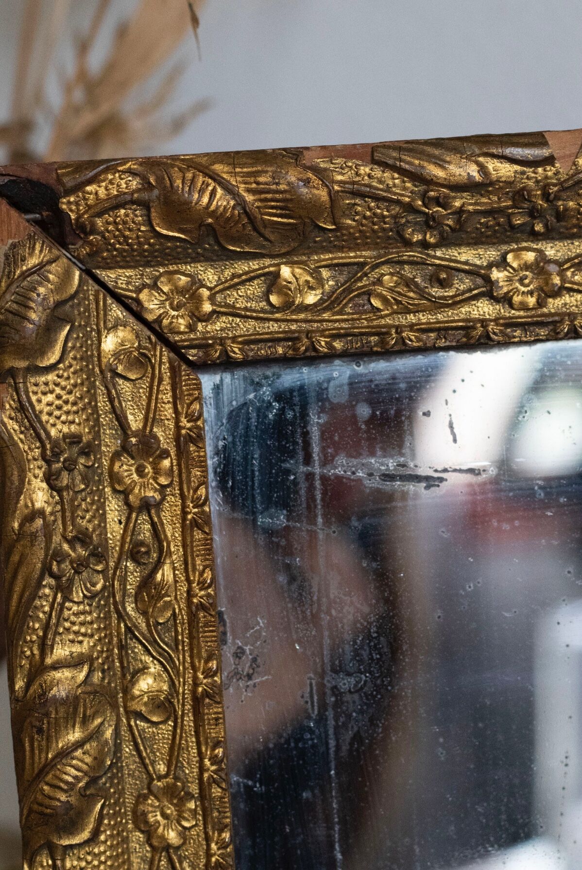 Antique mirror in gilded wood